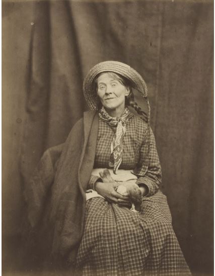 Woman holding dead bird